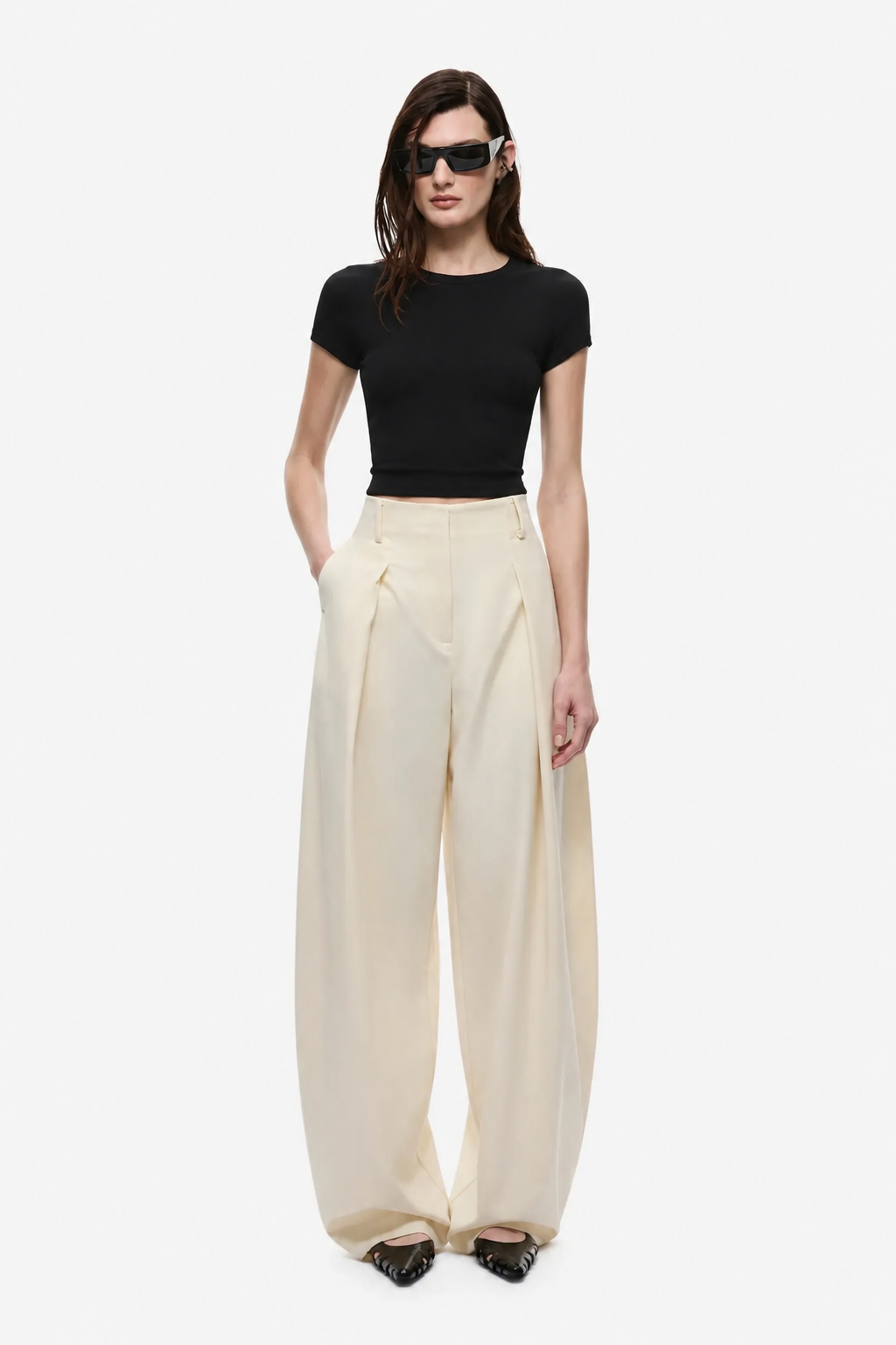 Cream wide-leg trousers with high waist and front pleat details