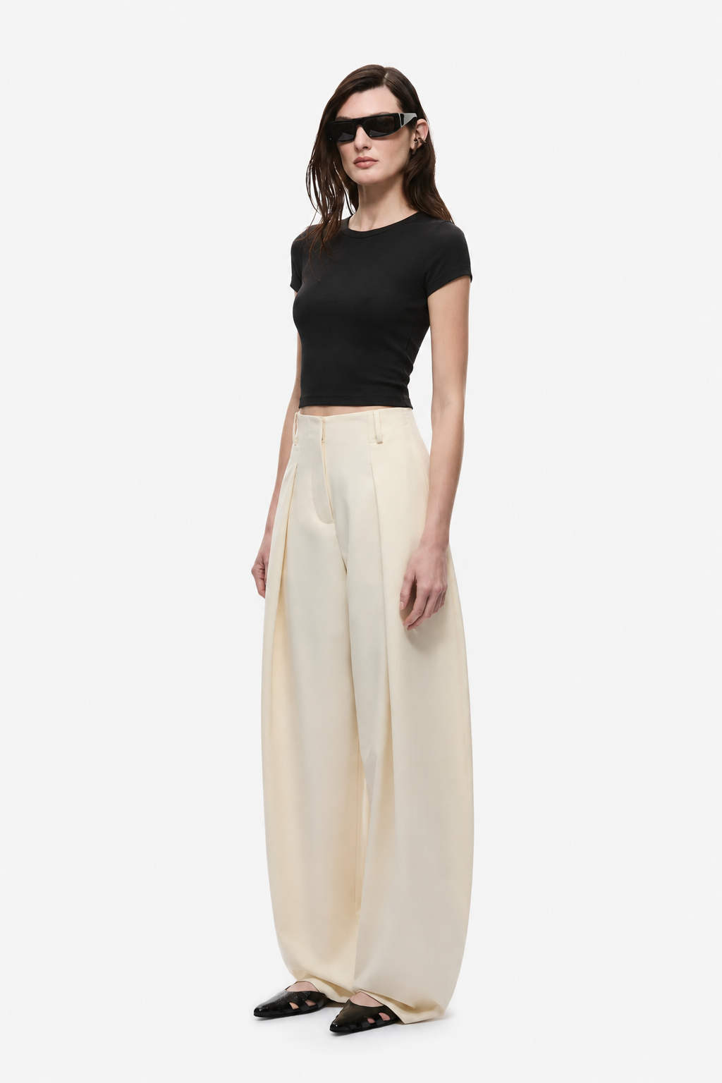Cream high-waist wide-leg trousers with front pleat and draped fabric