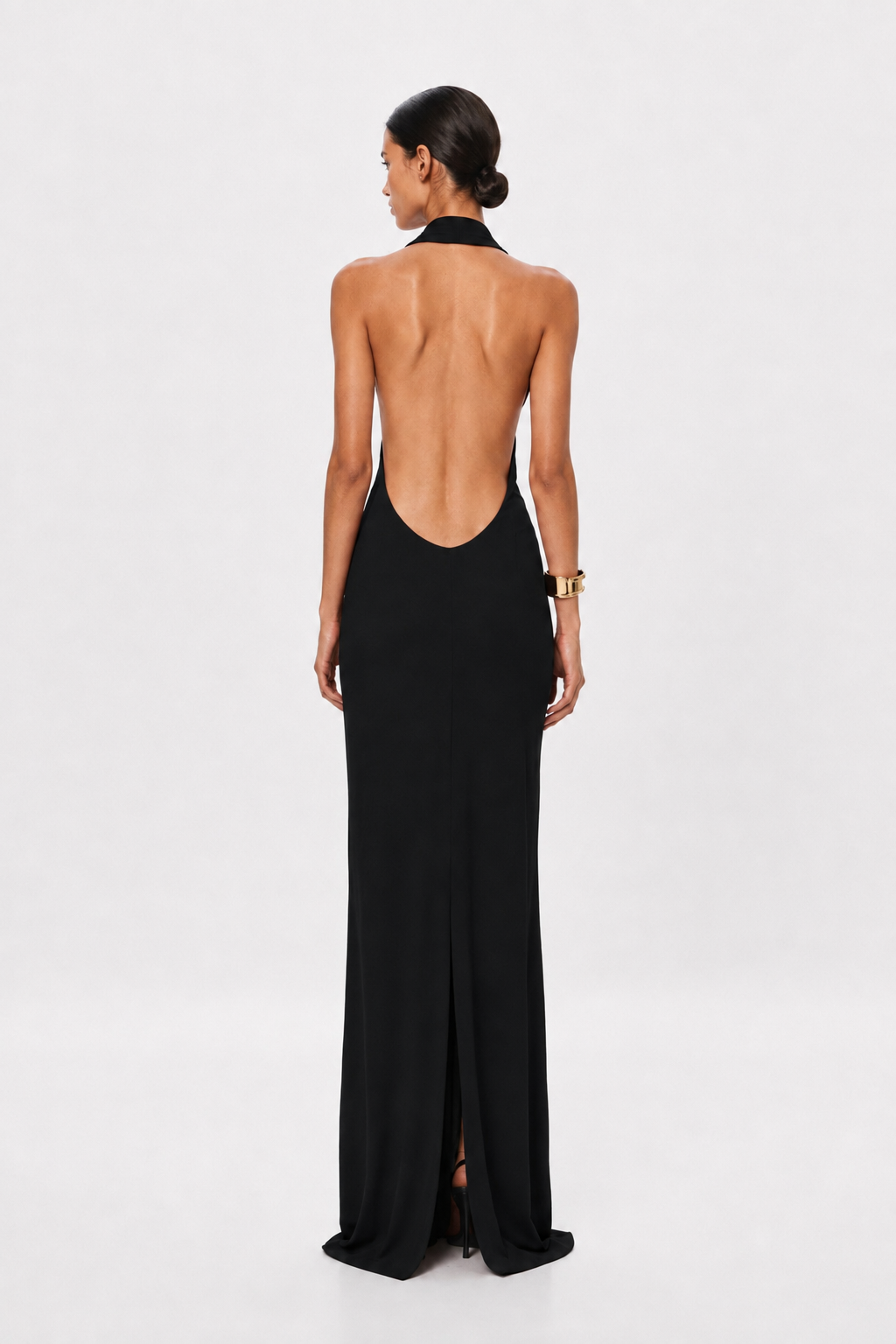 Black jersey halter maxi dress with open back and gathered drape
