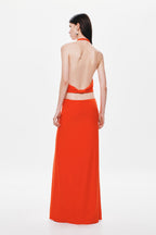 Back view of chili red sleeveless halter jersey maxi dress with open back cutout