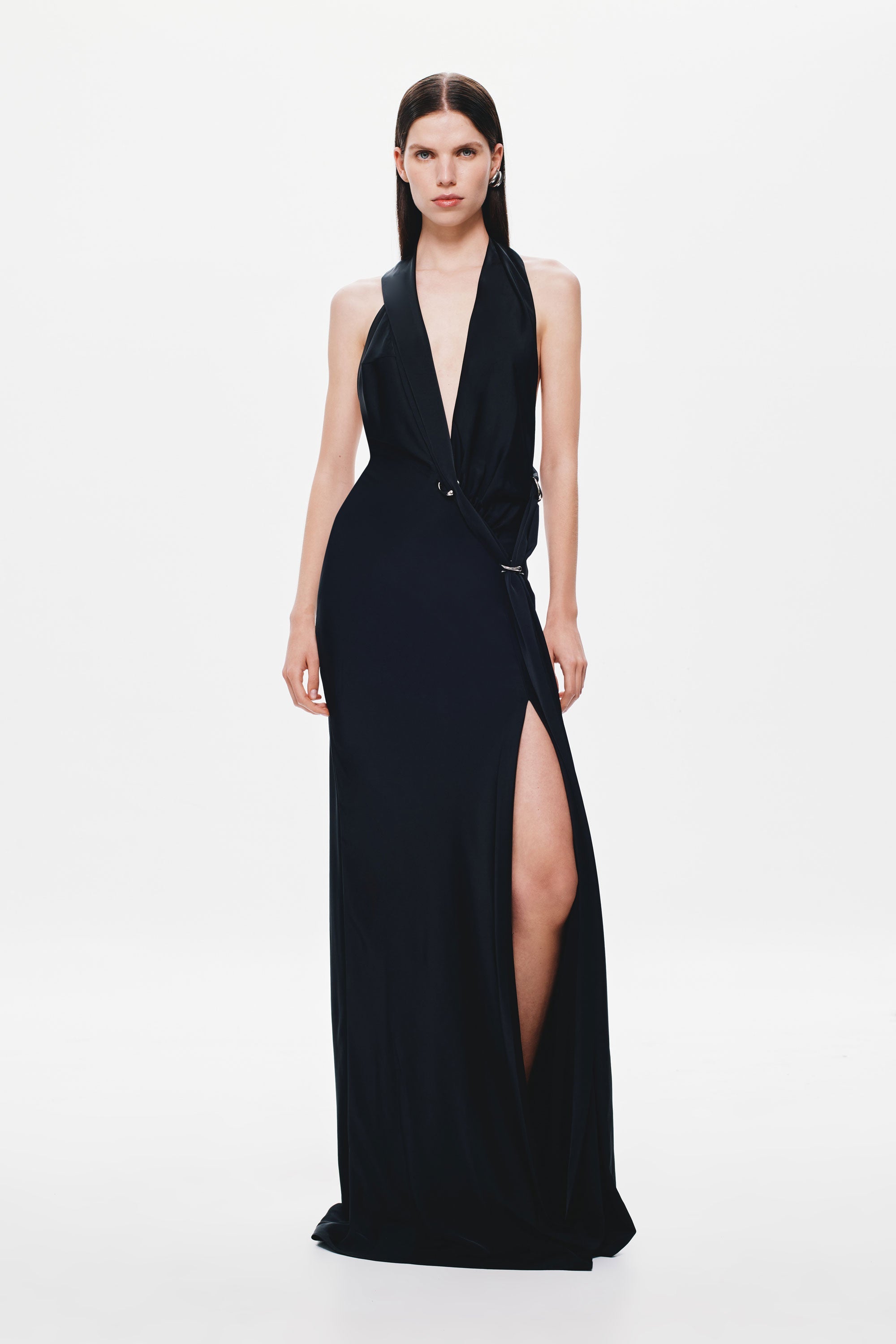 Black satin halter dress with deep V neckline and side slit