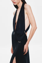 Black satin V-neck maxi dress with ruched center and metal eyelet details