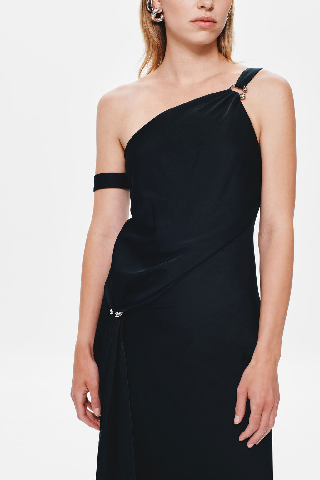 Black satin one-shoulder maxi dress close-up, draped front and buttons