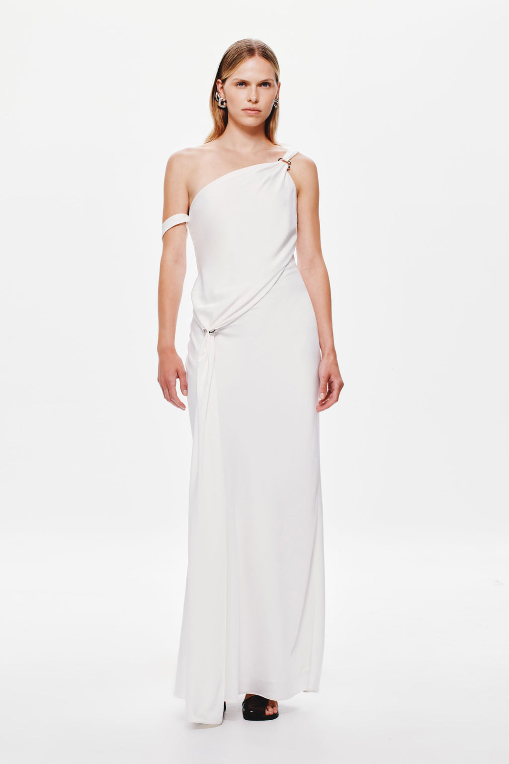 Ivory satin slip dress with one-shoulder neckline and gathered tie at waist