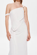 Ivory satin one-shoulder dress close-up with diagonal drape and waist tie