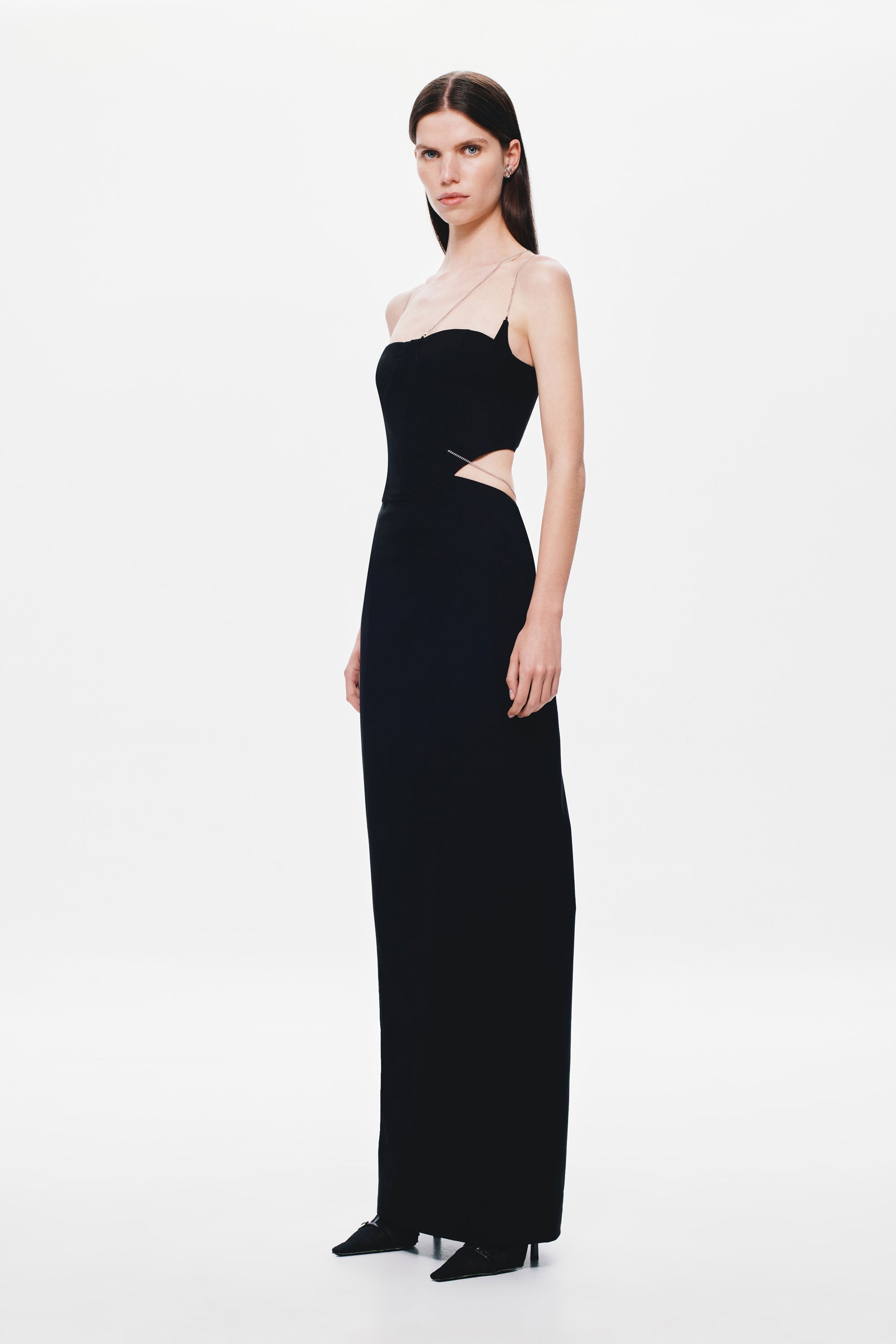 Black strapless maxi dress with thin straps and sleek column silhouette