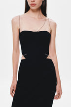 Black strapless bodice dress with thin spaghetti straps and curved neckline