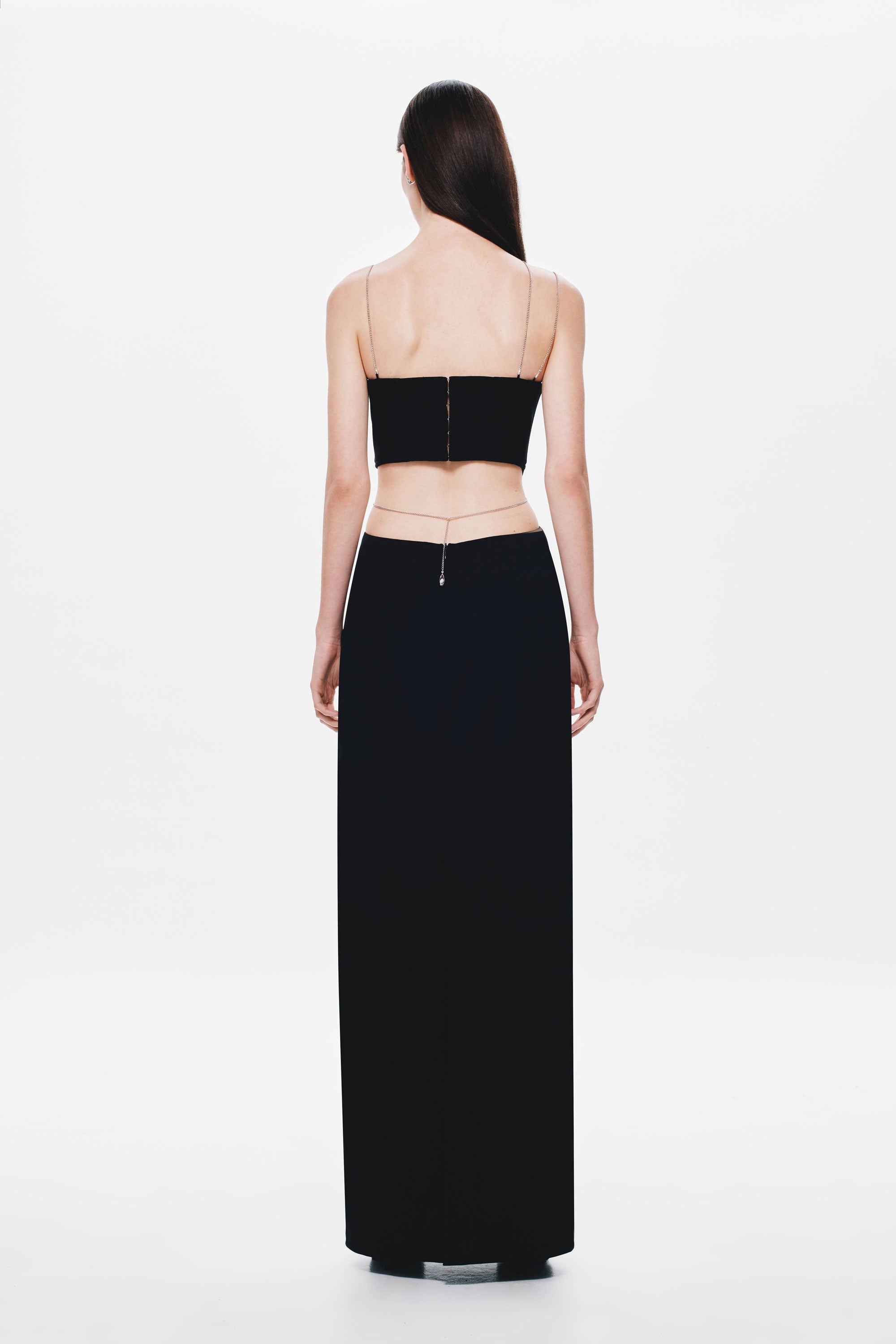 Black strapless maxi dress back with thin straps and corset-style panel