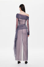 Back view of off-shoulder draped mesh dress with column skirt and sheer tulle hem detail.