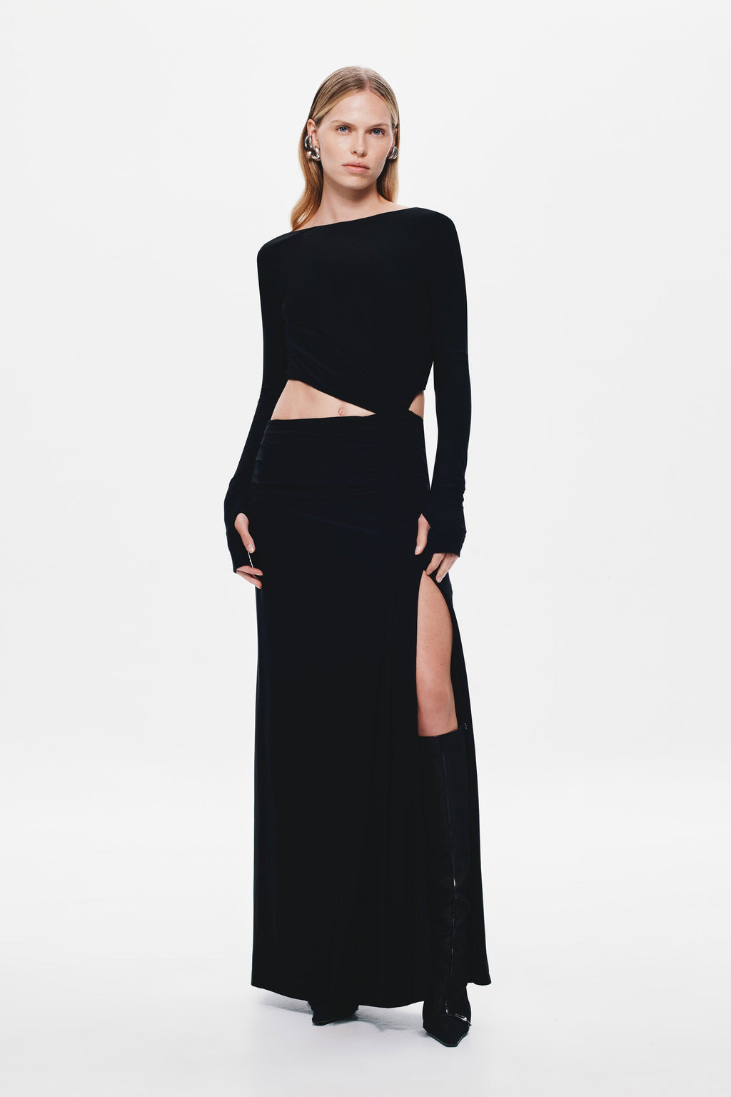 Black long-sleeve jersey maxi dress with one-shoulder neckline and waist cutout