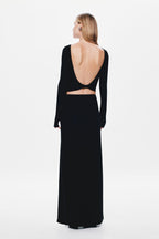 Black long-sleeve jersey maxi dress shown from back with open back waist cutout