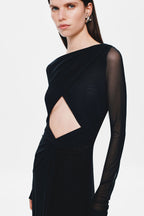 Black jersey maxi dress close-up with diamond cutout and draped crossover bodice