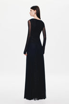 Black long-sleeve maxi dress back view with sheer upper back panel and drape