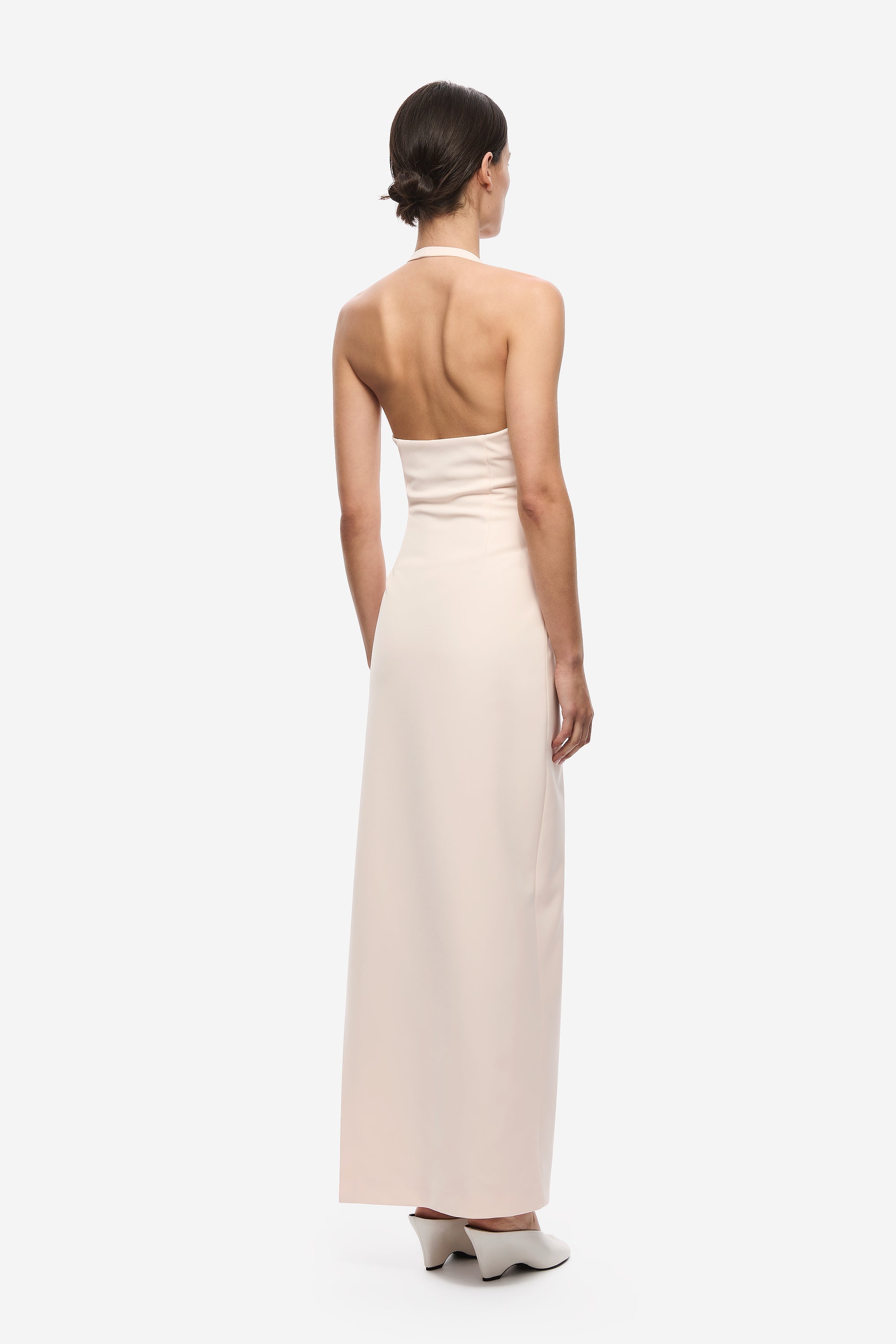 Soft pink halter back crepe maxi dress with open back and long column shape