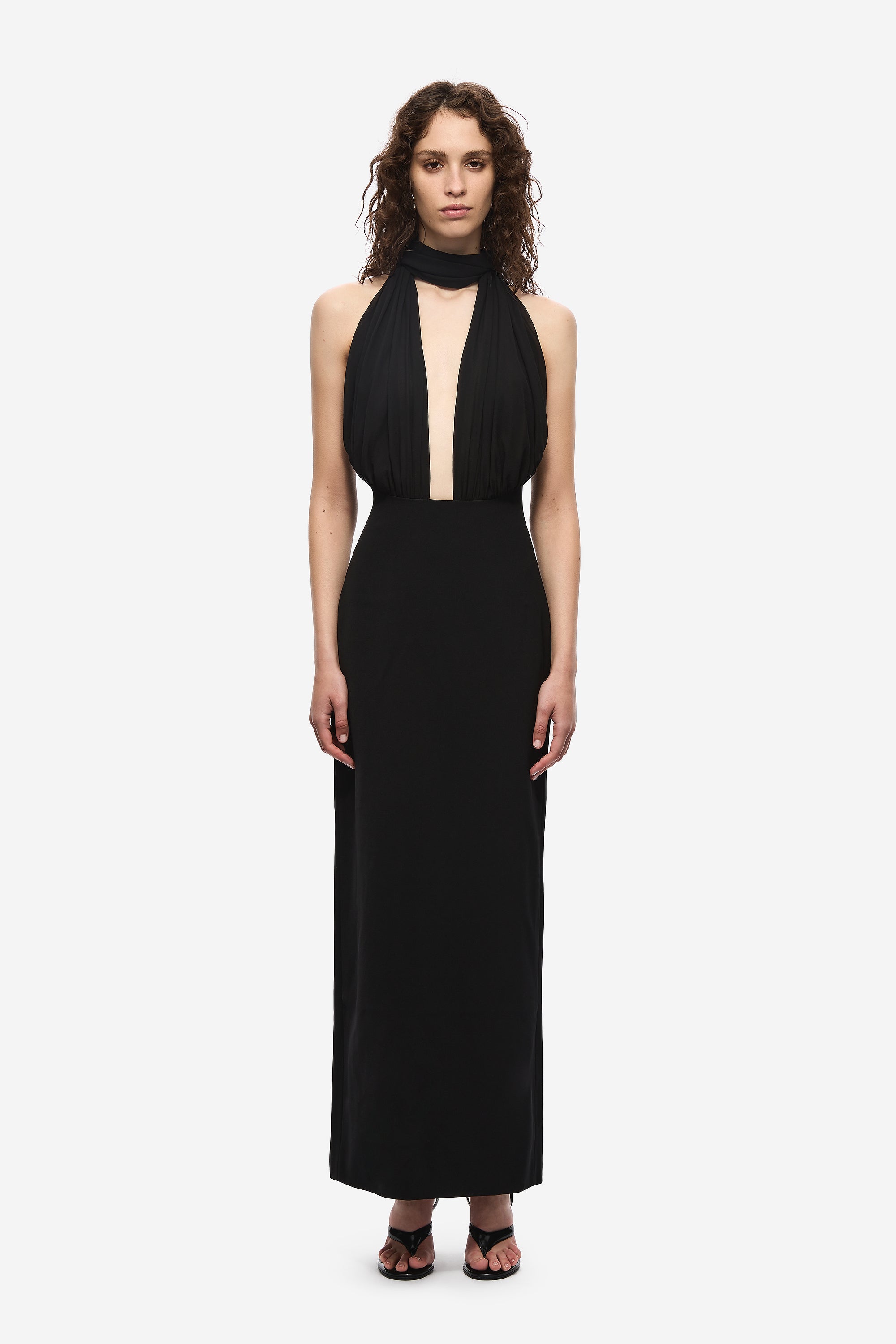 Black halter silk dress with draped neckline and center cutout panel