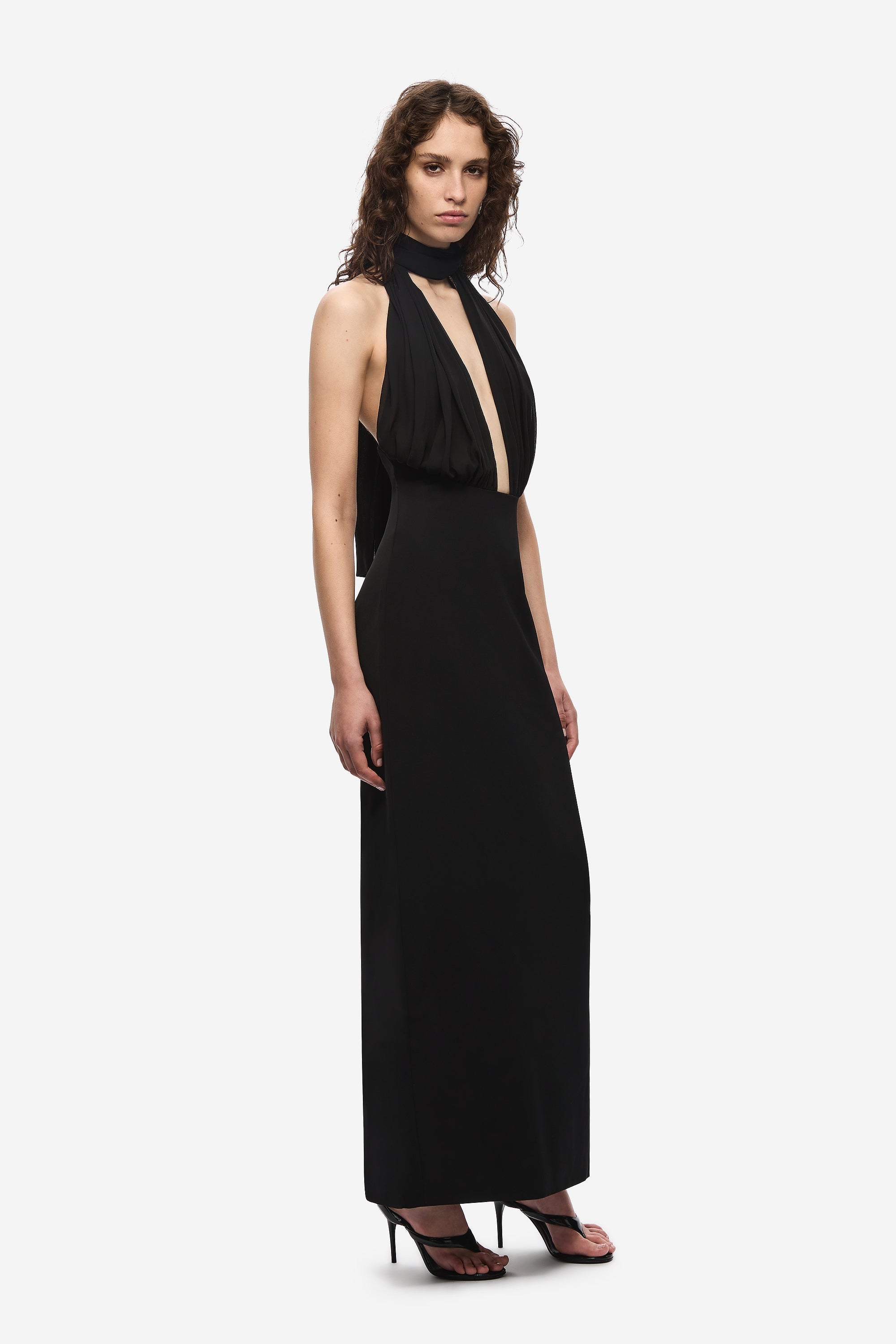 Black halter silk dress with draped halter neck and vertical cream panel