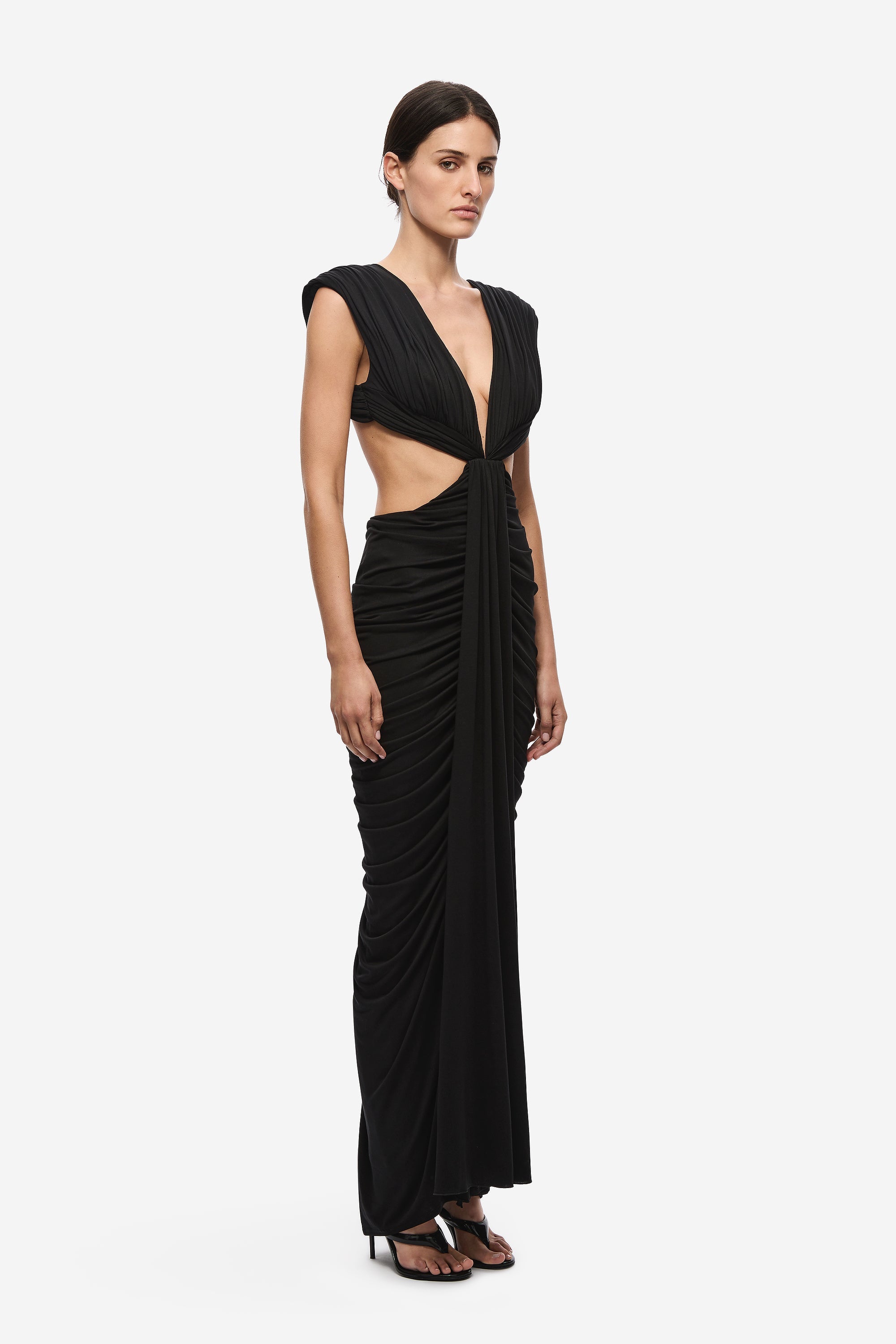 Black V-neck ruched gown with cap sleeves, draped waist, and side gathering