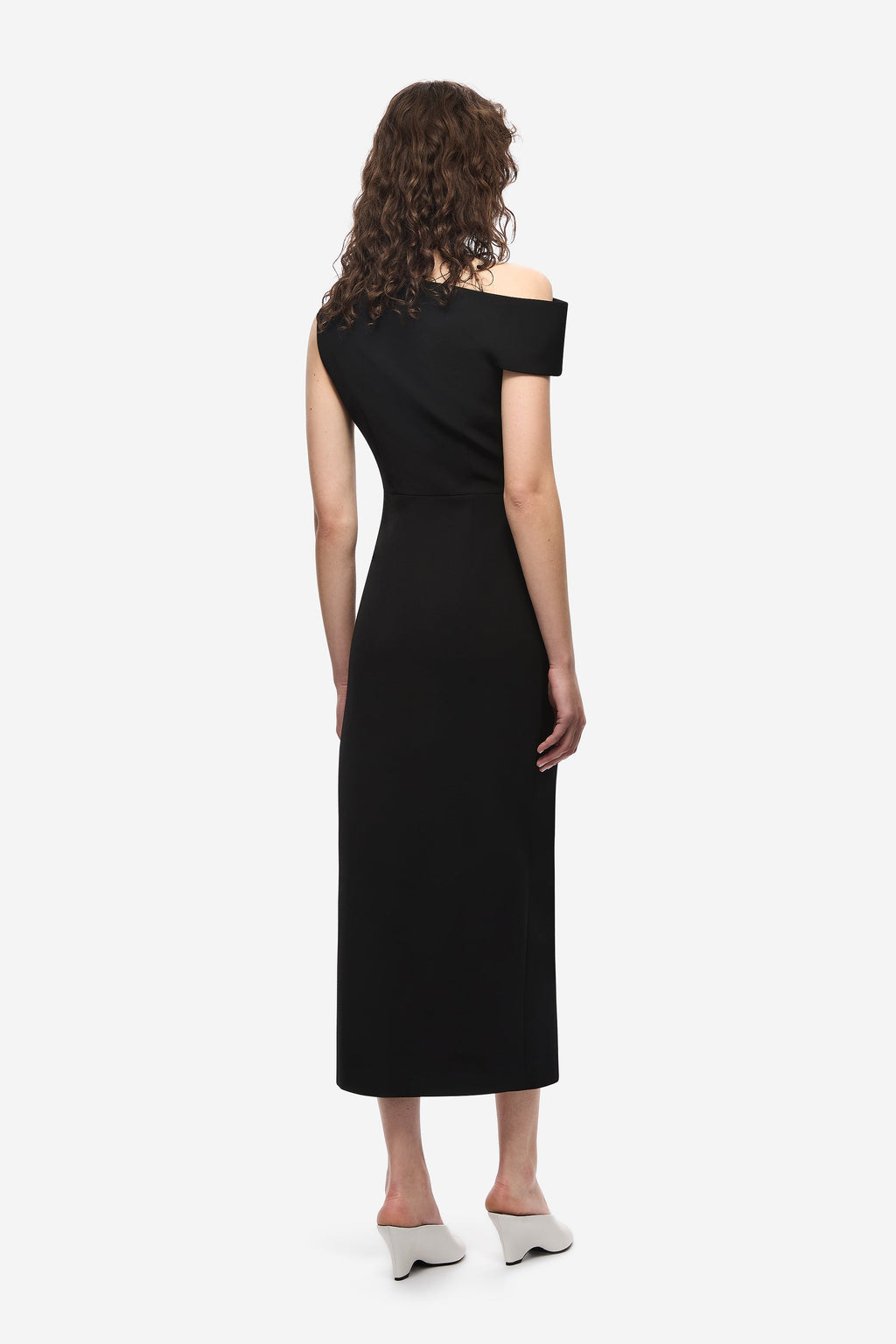 Black crepe midi dress, back view with off-shoulder neckline and fitted drape