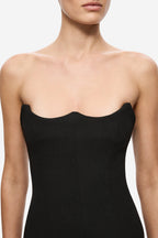 Black crepe midi dress close-up: scalloped sweetheart bustline and thin straps
