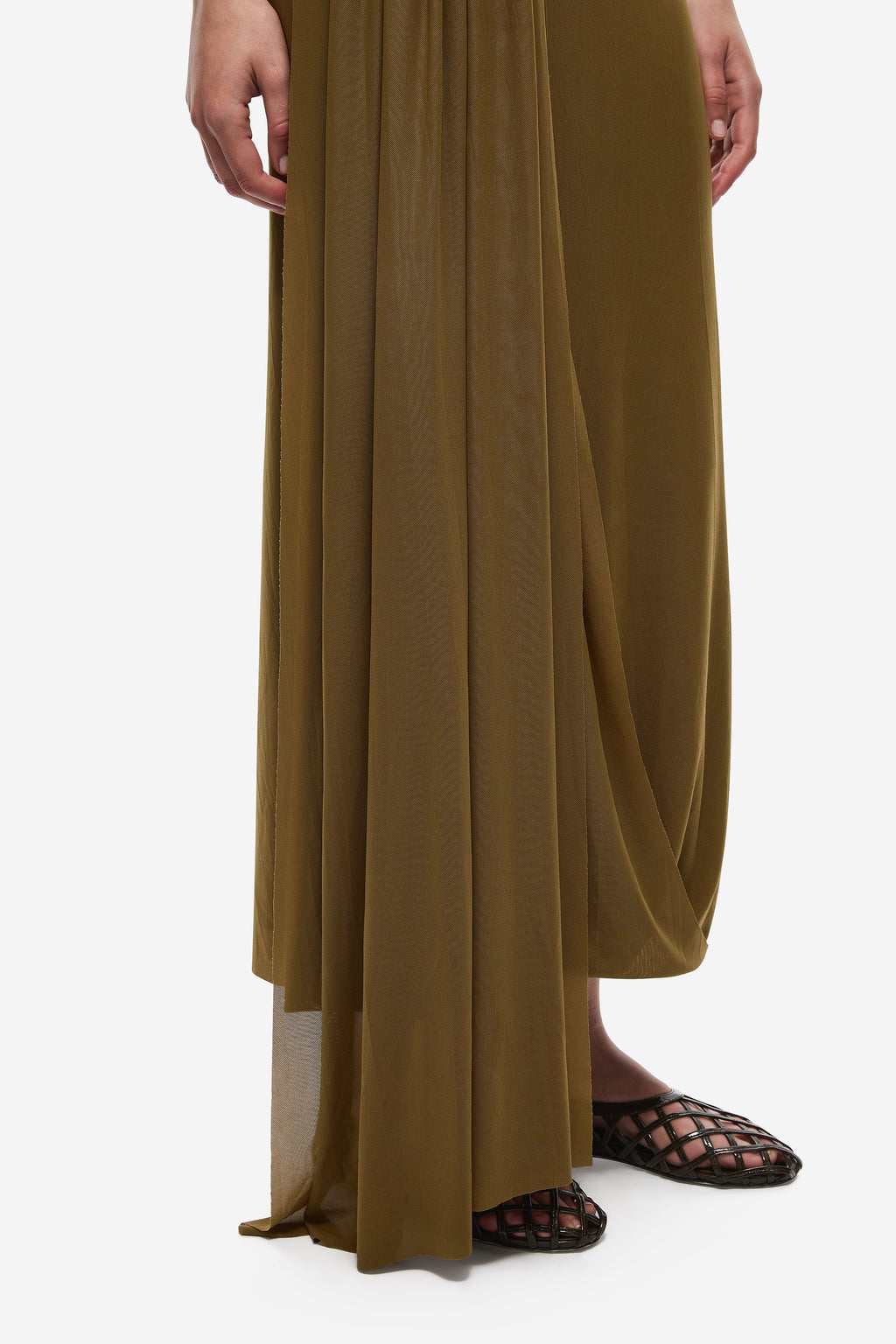 Olive mesh midi dress close-up of draped skirt panels and hem