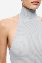 Sky blue mesh dress close-up: mock neck and shoulder-side cutout opening