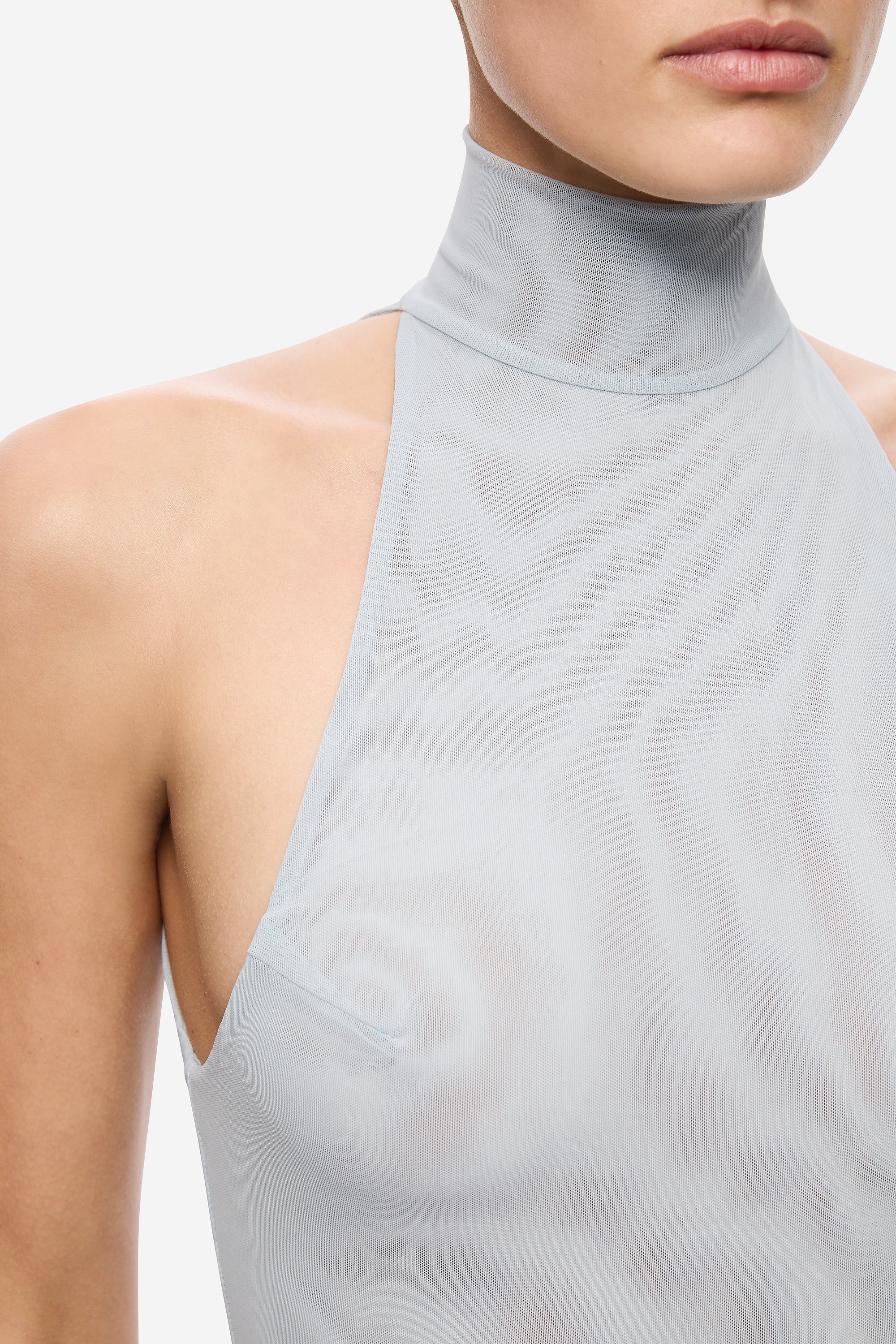 Sky blue mesh dress close-up: mock neck and shoulder-side cutout opening