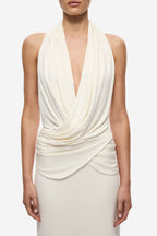 Ivory sleeveless halter dress with deep V neckline and draped ruched bodice