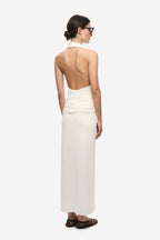 Ivory sleeveless backless dress with draped straps and gathered lower back