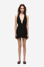 Black sleeveless mini dress with halter neckline and draped pleats