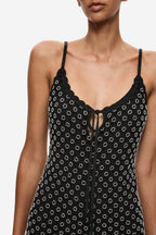 Front close-up: black beaded crochet mini dress with lace-up center and thin spaghetti straps