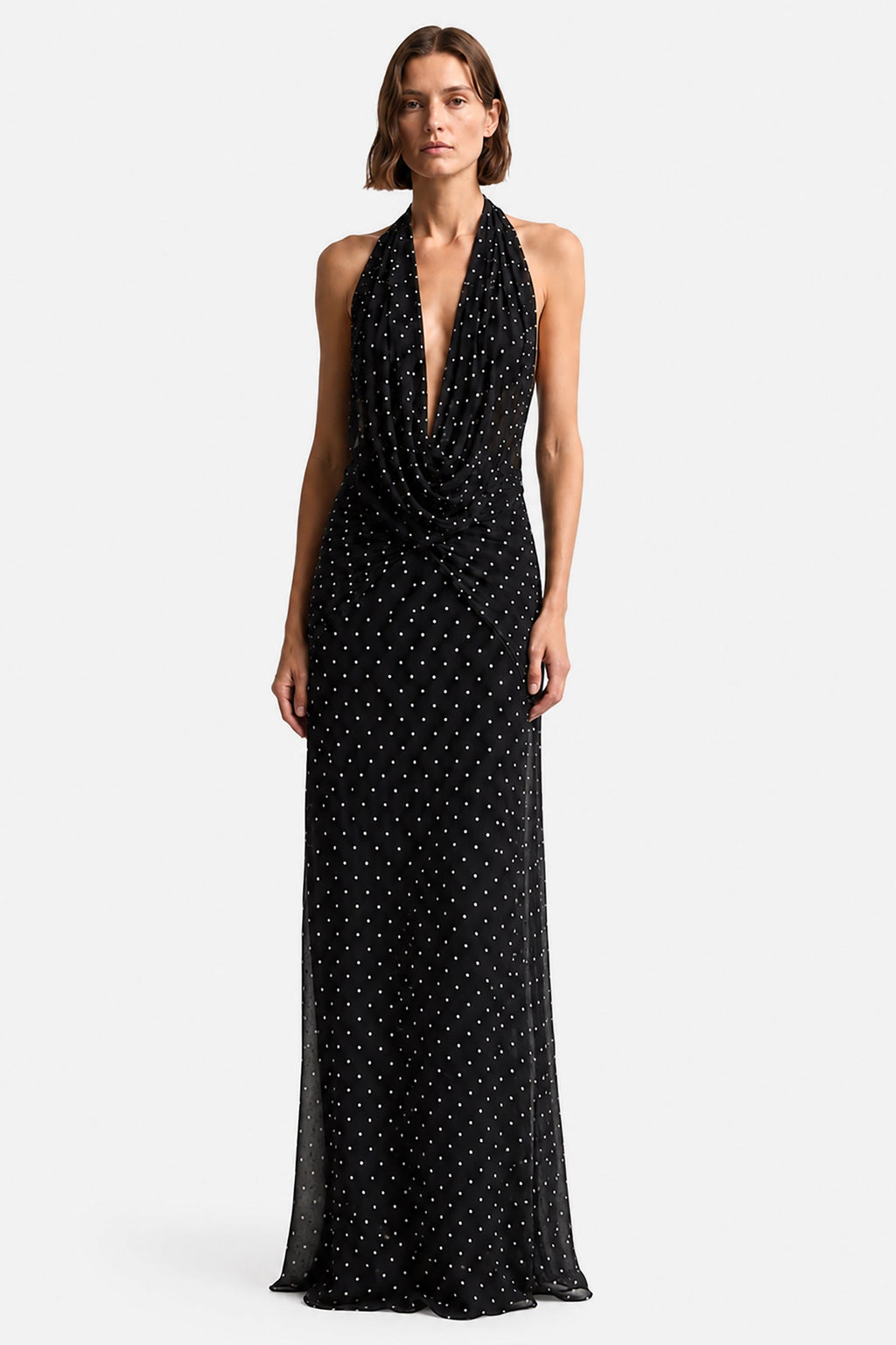 Black sleeveless maxi dress with plunging V neckline and dotted print