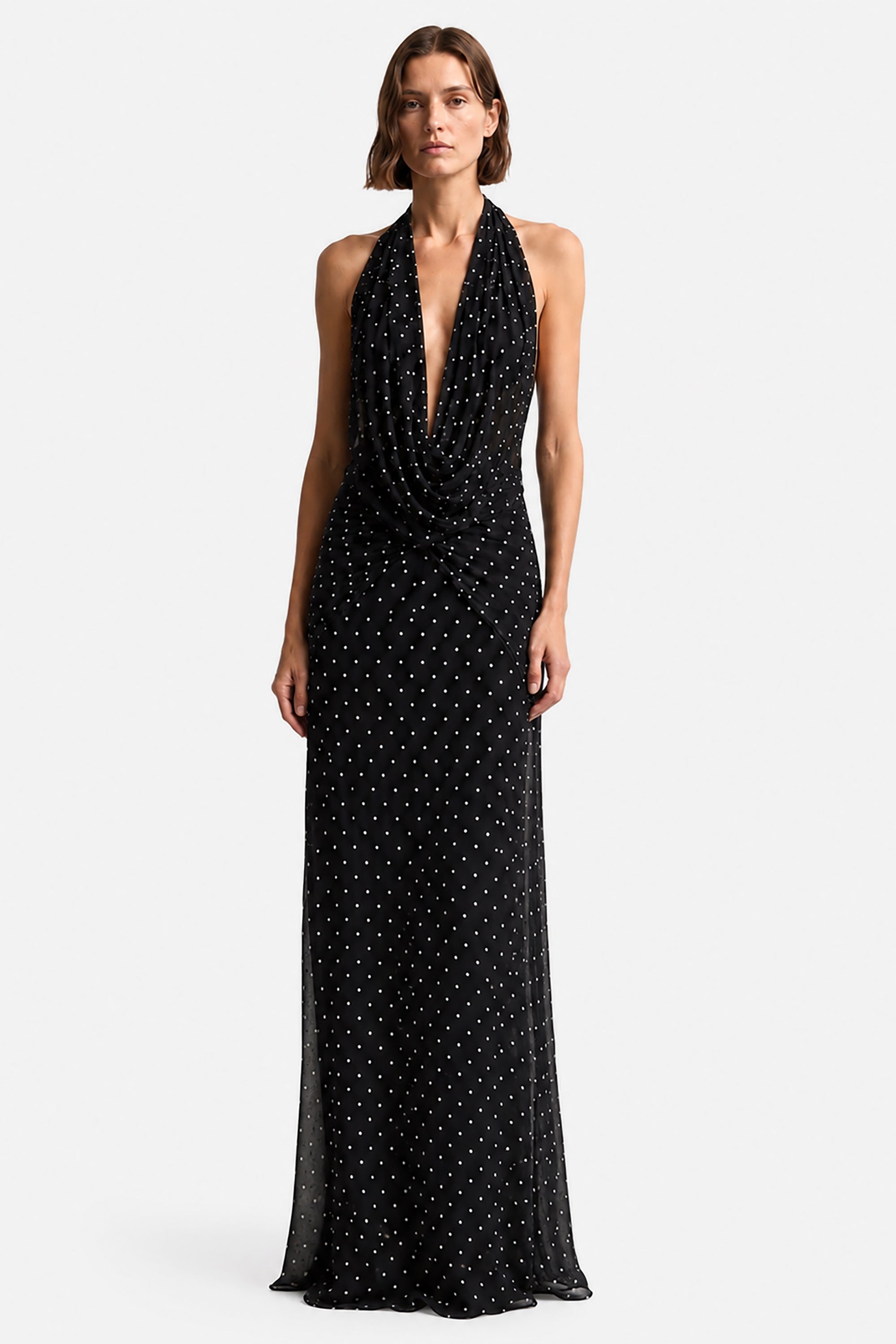 Black sleeveless maxi dress with plunging V neckline and dotted print