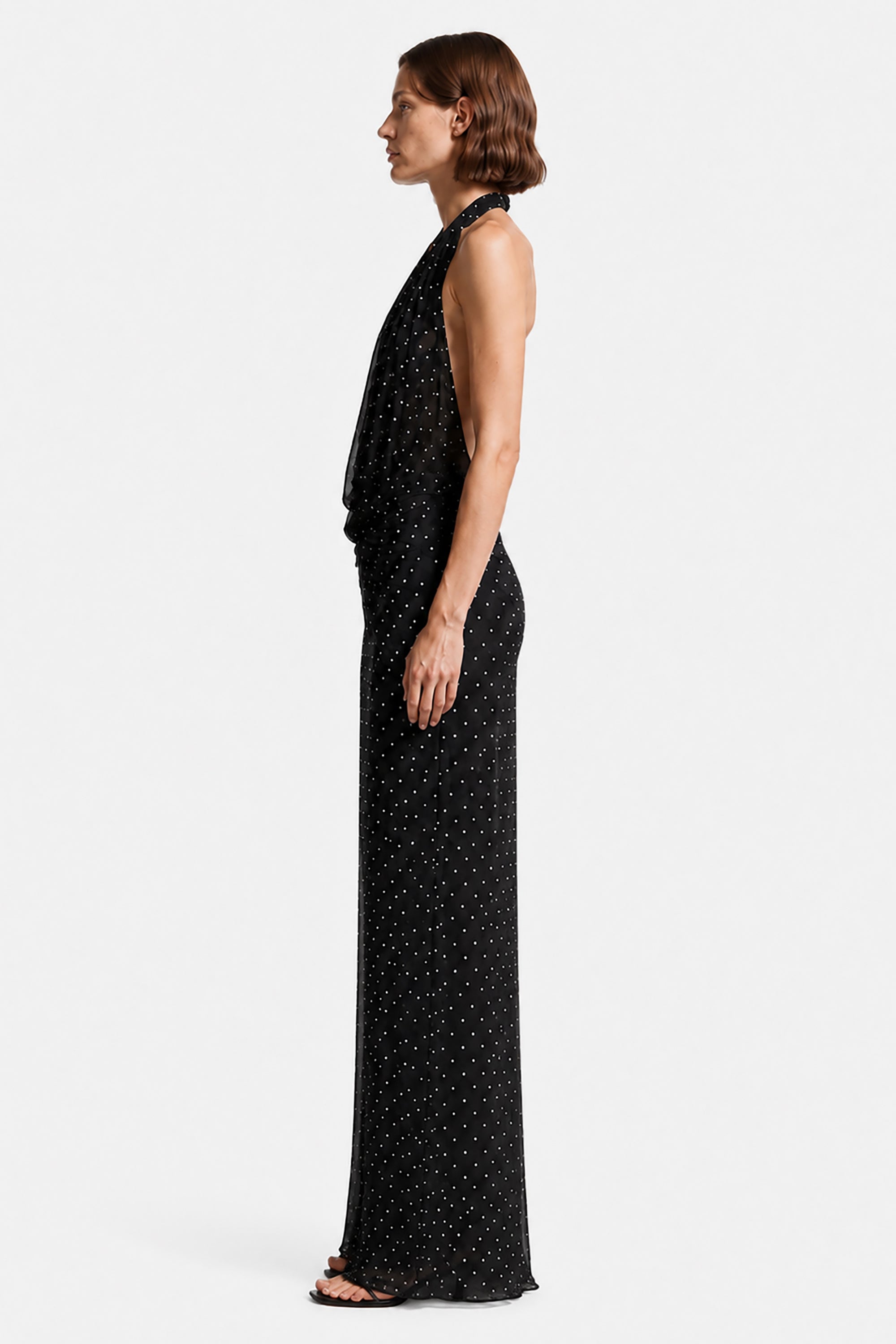 Black sleeveless maxi dress, side view, dotted allover print and V neckline