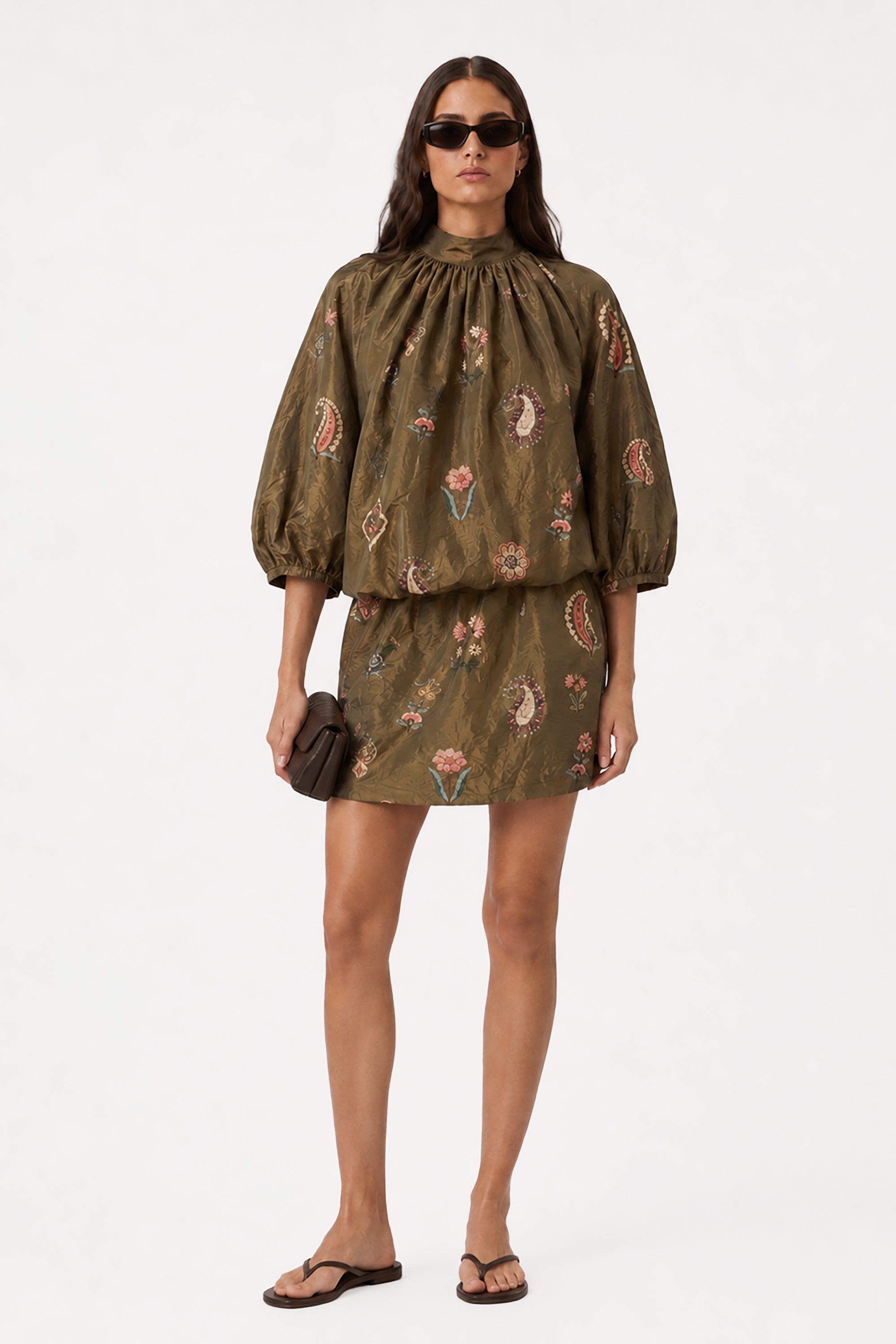 Olive mini dress with high neck ruffle, long puff sleeves, and floral print