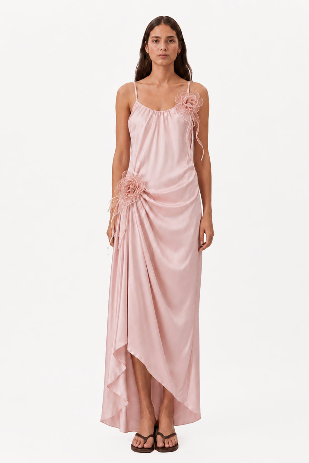 Blush pink maxi dress with rosette drape, spaghetti straps, and asymmetrical hem