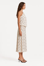 Ivory one-shoulder drape midi dress, side view, dotted print and waist tie