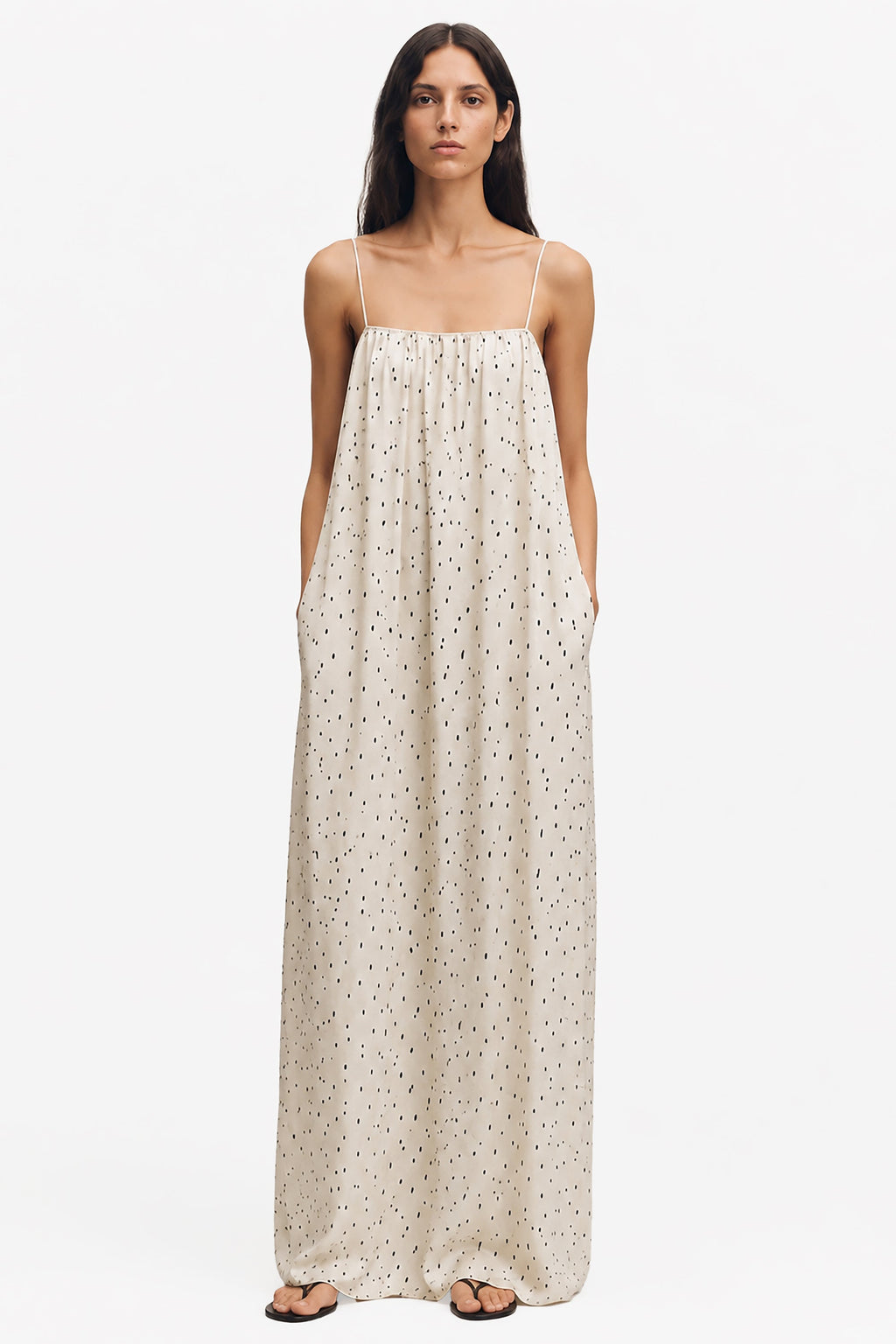Ivory printed maxi trapeze dress with spaghetti straps and dotted speckle pattern