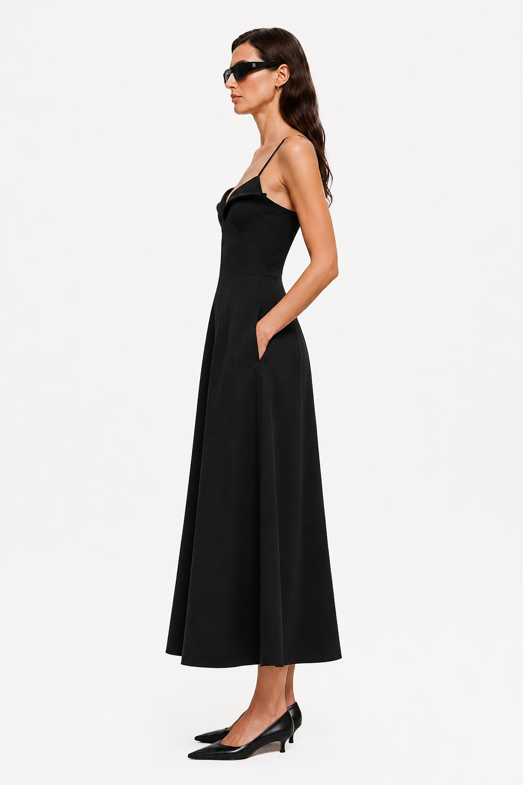 Black midi crepe dress with thin straps and fitted waist, side view