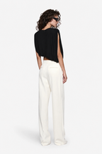 Black sleeveless draped jersey top, back view with gathered shoulder and folds