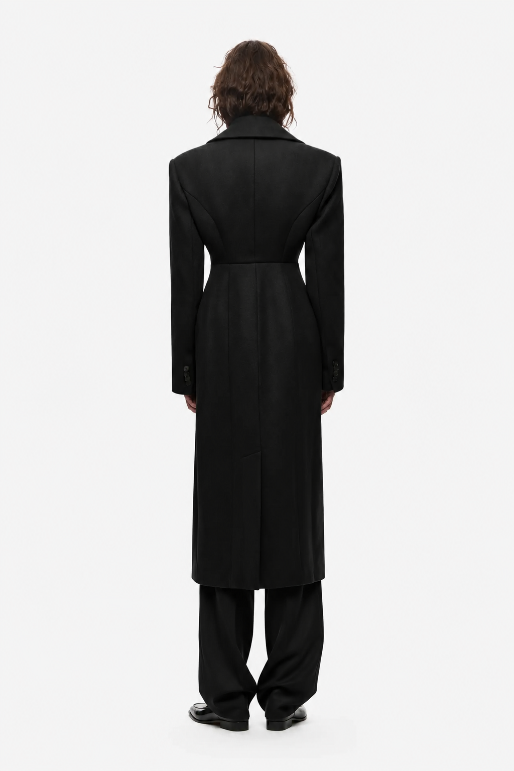 Black long coat, back view with center seam and waist belt