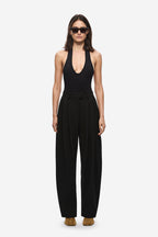 Black high-waist pleated barrel-leg trousers with wide straight legs