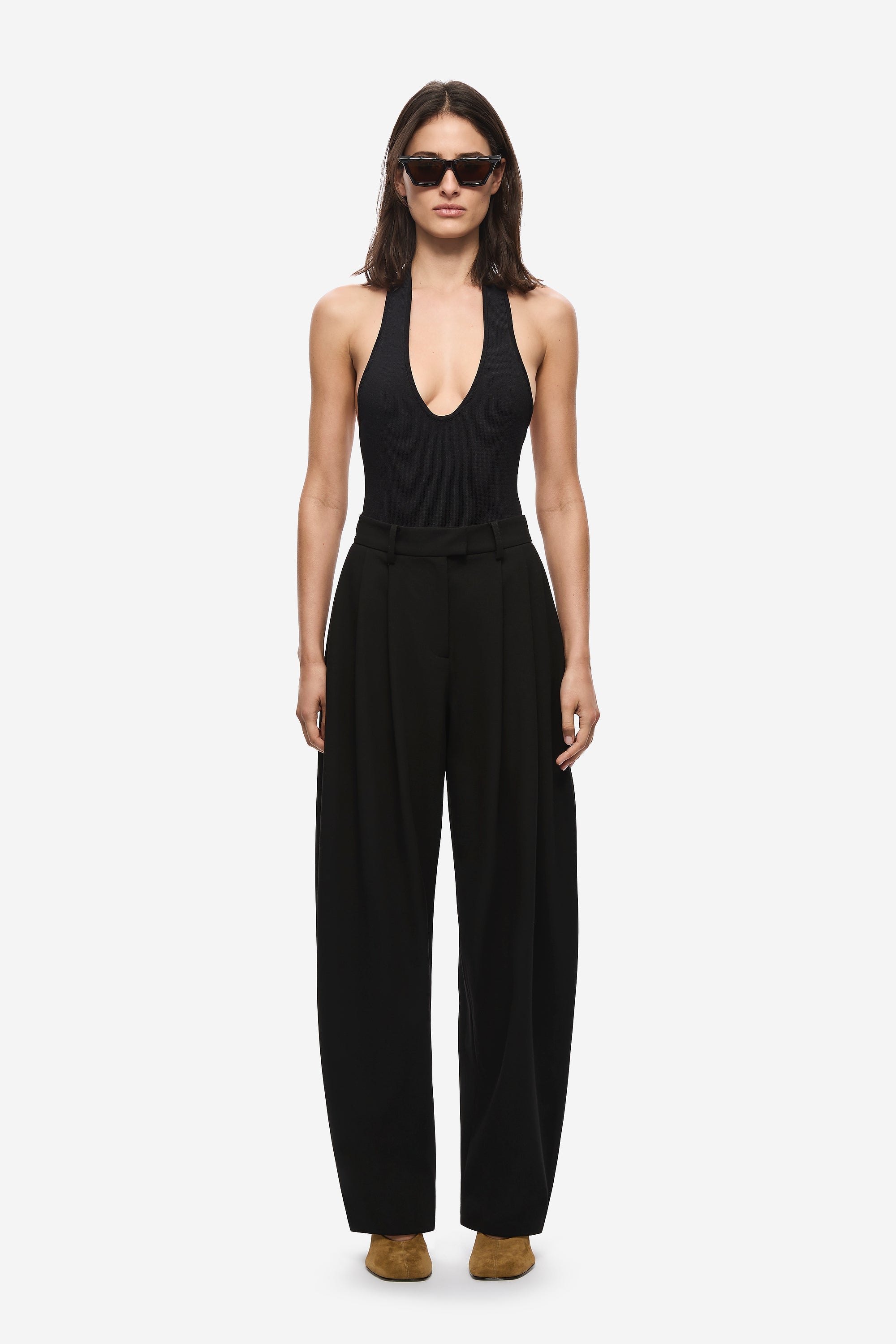 Black high-waist pleated barrel-leg trousers with wide straight legs