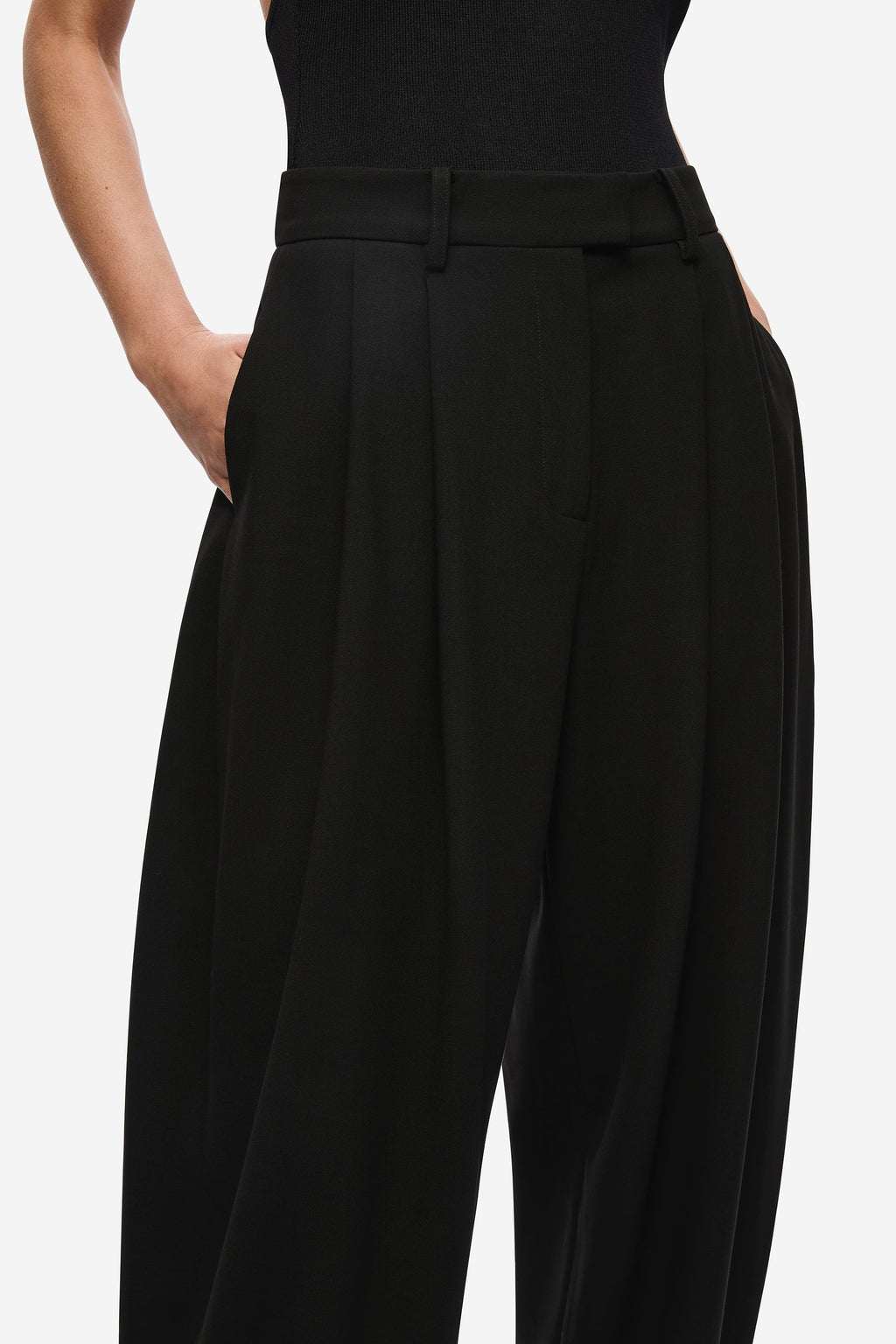 Black pleated waistband trousers with button closure and belt loops