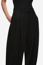 Black pleated waistband trousers with button closure and belt loops