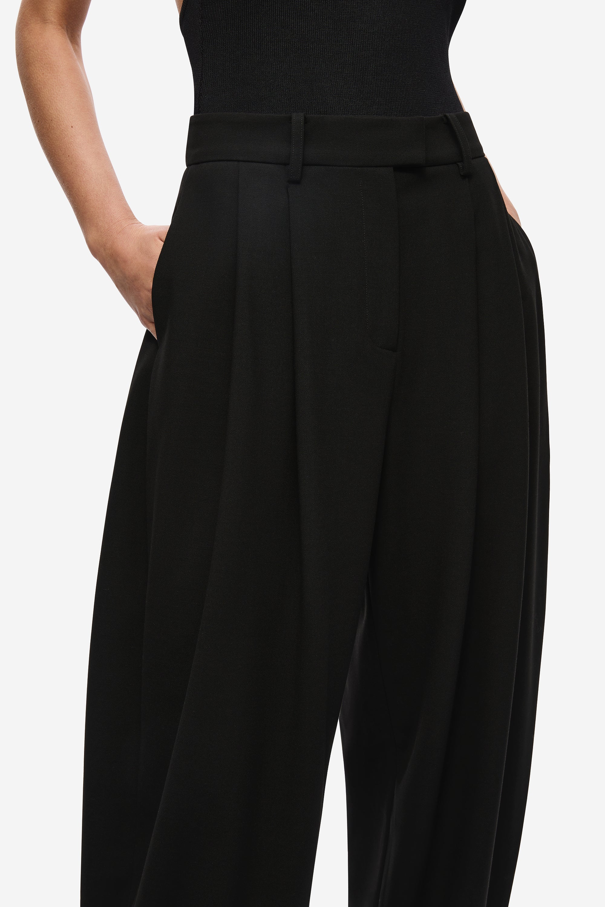Black pleated waistband trousers with button closure and belt loops