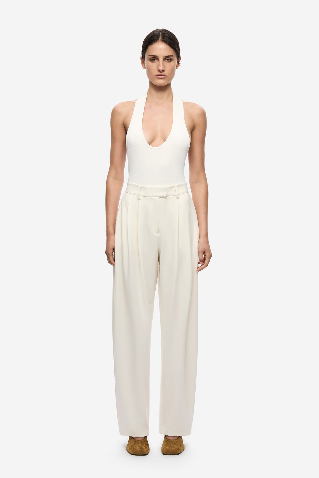 Ivory pleated barrel-leg trousers with high waist and drapey wide-leg silhouette