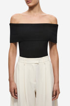 Black off-shoulder knit bodysuit, fitted bodice and high-cut leg