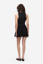 Black flared knit mini skirt, back view with short A-line hem