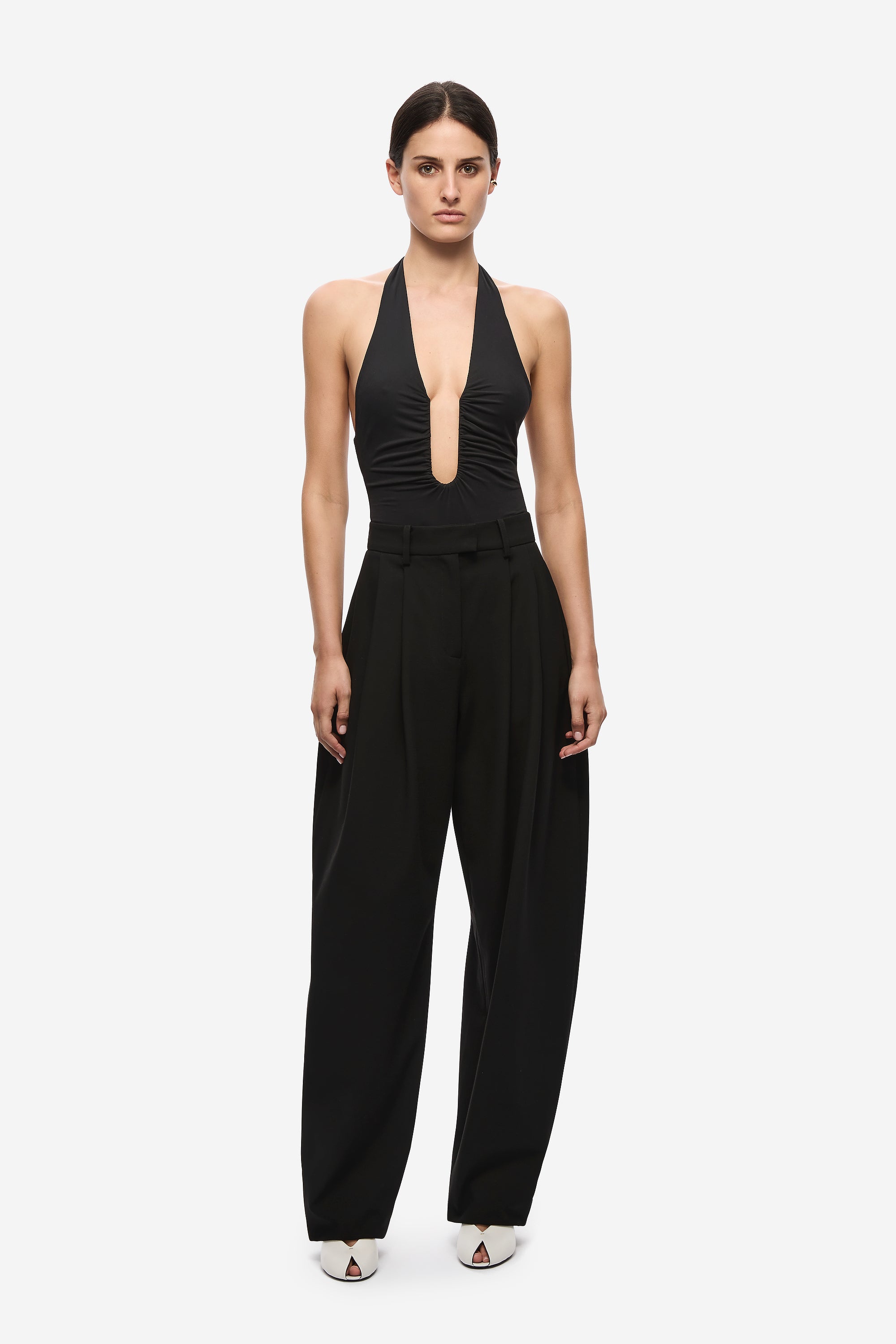 Black halter bodysuit with keyhole plunge front and wide-leg pants