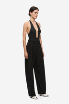 Black halter bodysuit with keyhole plunge front and wide-leg trousers
